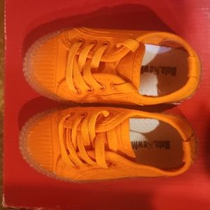Orange canvas tennis shoes. Transparent Soles. Size 26.fits like a 9-9.5 toddler